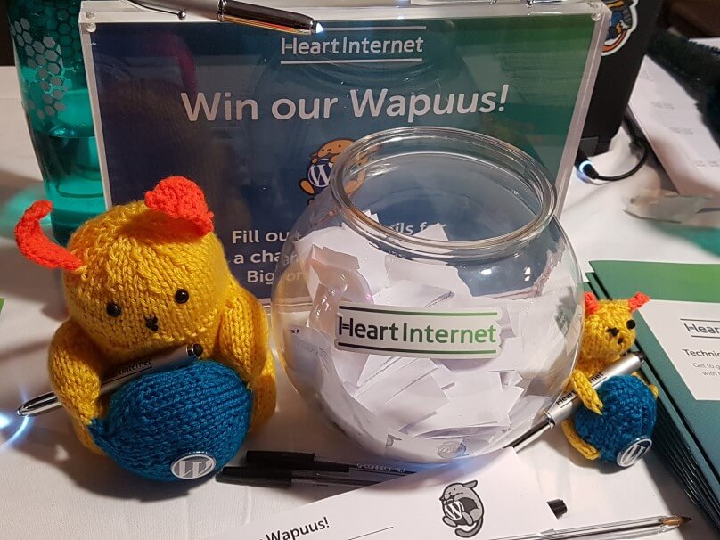 Heart Internet swag including knitted Wapuu toys